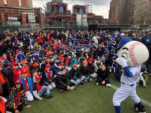 <b>Mr. Met entertains the crowd of Little Leaguers who assembled on historic Con Ed. Field on E. 16th St. and the FDR Drive following the annual opening day parade for the Peter Stuyvesant Little League on April 6.</b> Photo: Keith J. Kelly