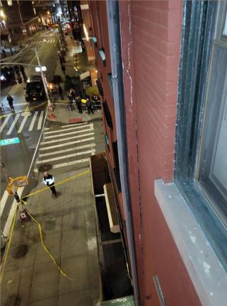 <b>The corner of Grand Street and MacDougal St. in Little Italy was cordoned off following a wall and chimney collapse after construction work destabelized an entire building that now must be demolished, according to the DOB. </b>Photo: Department of Building