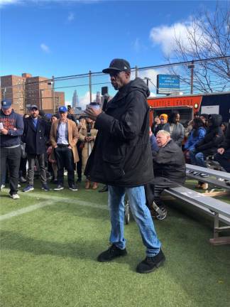 <b>Former Cy Young Award winner Doc Gooden heard some good natured boos when he urged kids to not argue with umpires at the opening day ceremony of Peter Stuyvesant Little League. Former League Commissioner Phil McManus (seated on bench) was among the people who turned out to listen (he didn’t boo).</b> Photo: Keith J. Kelly