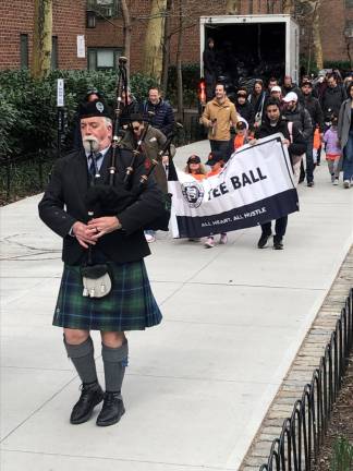 <b>Bagpipers lead the opening day parade of the Peter Stuyvesant Little League on April 6 through Stuyvesant Town.</b> Photo: Keith J. Kelly