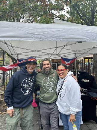 President of LES Sports Academy, Francisco Alameda; Alejandro Epifanio Torres, Executive Director of Loisaida Inc. Center; and Community Organizer for El Grito the LES, Lilah Mejia at the Hispanic Heritage Month Festival.