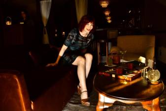 <b> Manhattan model Karen Rempel savors the sparkling speakeasy cocktail vibe in the Chelsea Living Room. Photo: Philip Maier</b>