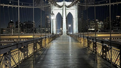 56 LED lights illuminate Brooklyn Bridge’s newly-scrubbed towers, which are being illimunated for the first time since its centennial in 1983.