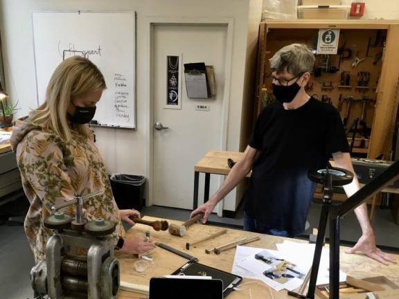 Among the first 92Y in-person offerings are socially-distanced studio lessons in jewelry making and ceramics. Aline Shapiro and David Butler were recently working in the jewelry studio. Photo courtesy of 92Y