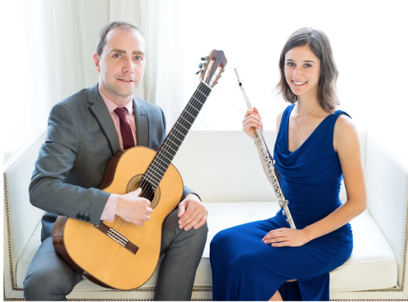 Damien and Jessica Kelly pose with their primary instruments, guitar and flute respectively. Photo courtesy of Damien and Jessica Kelly