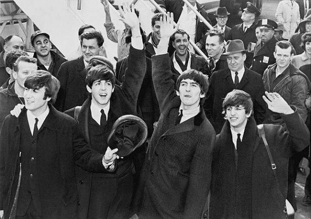 The Beatles arrived in New York City in Feb., 1964, helping revive a nation that was still in mourning from the assassination of John F. Kennedy less than three months earlier. The airport they landed in had only changed its name from Idewild to JFK International Airport in Dec., 1963. Photo: United Press International/Wikimedia Commons