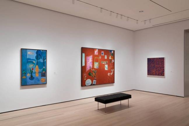 Installation view of Henri Matisse (Gallery 506) with Matisse’s “The Red Studio” and Alma Thomas’s “Fiery Sunset,” The Museum of Modern Art, New York. © 2019 The Museum of Modern Art.