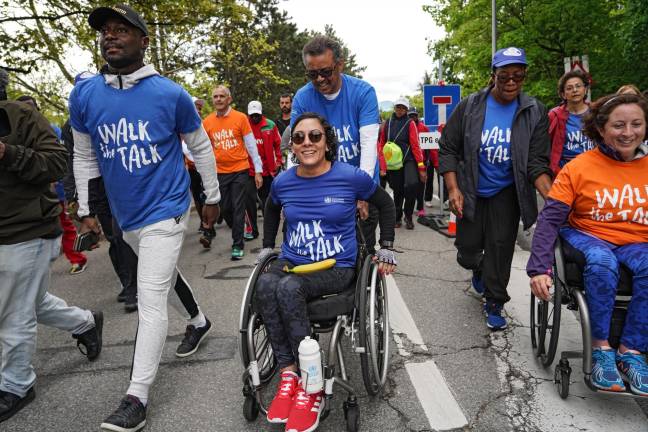 Walk the Talk event in Geneva last May, with Dr. Tedros Adhanom Ghebreyesus of WHO (center, pushing wheelchair).
