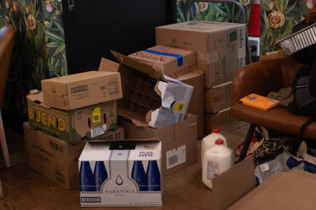Aaron Dahan says he's had to contasntly re-stock and order new supplies to keep up with the increasing demands. Here, boxes are stacked up in one corner of the cafe. (Priyanka Rajput)