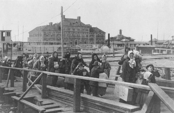 Immigrants arriving at Ellis Island, 1902. Photo: Public domain, via Wikimedia Commons
