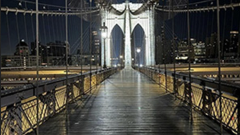 56 LED lights illuminate Brooklyn Bridge’s newly-scrubbed towers, which are being illimunated for the first time since its centennial in 1983.