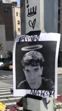 <b>A poster of Malcolm Livesey adorns a makeshift memorial on E. 17th St. erected by friends and neighbors a short distance from where the 18 year old was killed while riding a Citibike on First Ave. on June 16th. </b>Photo: Keith J. Kelly