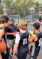 Kids gather round Coach Adrianne on the courts at the Battery Park City outlet of Asphalt Green.