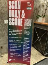 Lobby sign offers workers a chance to win football tickets as an incentive for coming into the office. Photo courtesy of GFP Real Estate