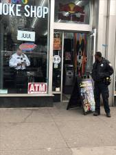 <b>Police respond to a robbery at a Manhattan smoke shop but rarely intervene for unlicensed sale of cannabis. Local political leaders say illegal stores are proliferating and have introduced legislation to the city council that would allow unlicensed shops to be padlocked.</b> Photo: Keith J. Kelly