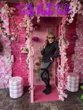 Marlena Brauer poses amid the pink cherry blossoms at the South Street Seaport.