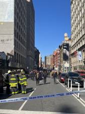 Firefighters at the scene of the partial collapse. Photo: Kay Bontempo.