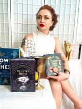 Shawn Engel with her four published works on various areas of witchcraft. Photo courtesy of Shawn Engel
