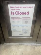 A sign on the door tells the story: Beth Israel Hospital, which served the downtown community since 1889, was shut down by Mount Sinai on April 9.