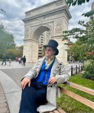 Adam Pajkowski strikes a sophisticated pose near the arch in Washington Square Park. Photo: Sophie Collongette