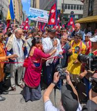 Senator Chuck Schumer (left), Mayor Eric Adams (with microphone), and hundreds of others at the Nepal Day opening ceremony.