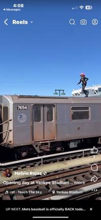As the Yankee Express neared the Stadium on opening days, fans spotted a subway surfer running atop the a southbound 4 train. Yankee Stadium can be seen in the background. The surfer fled but the MTA said on March 31 that an 18 year old who self identifies as female, had been arrested for the stunt.