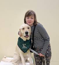 Ten-year-old Naomi Wood is two years into her recovery from brain cancer. Post surgery and treatment at Memorial Sloan Kettering Cancer Hospital, Naomi is taking things one step at a time, with her golden retriever service dog, Elroy, by her side.