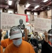 A Chinatown tenant group, protesting the proposed rent hike for stabilized units during a public comment hearing on June 12th. They bore signs reading “Adams Wants To Raise The Rent: Rent Rollback Now”.