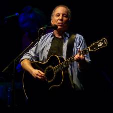 Paul Simon playing at the 9:30 Club in Washington, D.C. in 2011. Photo: Matthew Straubmuller, via Wikimedia Commons