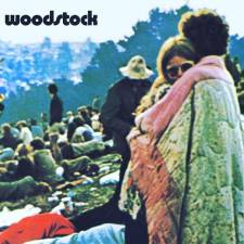 The iconic photo of a young woman wrapped up by her boyfriend’s blanket became the cover of the Woodstock soundtrack album. The young couple, Bobbi Kelly and her then-boyfriend, Nick Ercoline, married a few years later and were together for 54 years until her death in March. Photo: Pintrest