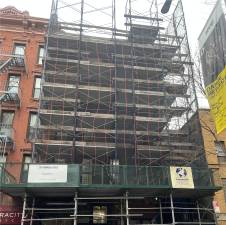 Preservationists are rallying to save 139 Thompson St. (above), a landmarked building with rent-stabilized units, from demolition. The building’s mysterious owner wants to build condos on the site.