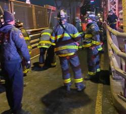 Firefighters on the Ed Koch Queensboro Bridge on the night of Feb. 16 when a 16 year old boy was pulled from a 50 ft maintenance shaft and transported to a local hospital in critical but stable condition.