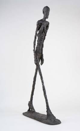 Bronze &quot;Walking Man&quot; (1960; cast 1982), part of a trio of sculptures that Giacometti considered submitting for display on the plaza of the new downtown headquarters of Chase Manhattan Bank near Wall Street. Fondation Giacometti, Paris. &#xa9; 2018 Alberto Giacometti Estate/Licensed by VAGA and ARS, New York