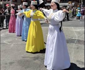 NYC Dance Parade participants in a spectrum of colors.