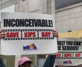 Protestors held signs and chanted “Save our theater!” outside of the Kips Bay AMC 15 in protest of its planned closure at the end of the year.