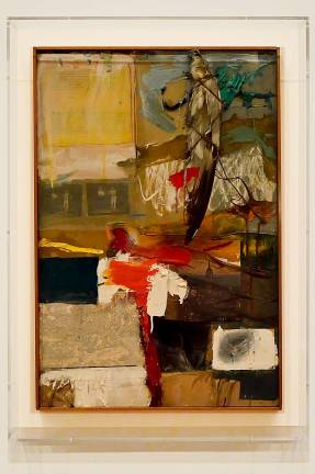 “Painting with Grey Wing” (1959) includes oil paint, printed reproductions, an unpainted paint-by-number board, typed print on paper, photographs, fabric, a stuffed bird wing, and some spare change. Photo: Adel Gorgy
