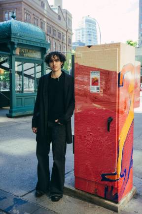 Village Alliance Art Competition winner and Cooper Union student Ari Barash at Astor Place, where his winning series <i>LONG LIVE YUL: NOMADIC COSMOLOGY </i>is on display, adorning the area’s utility boxes.
