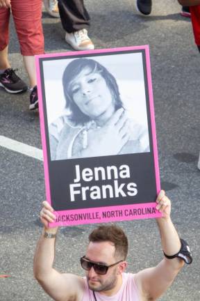 A marcher carries a sign memorializing Jenna Franks, a trans woman murdered in North Carolina. Photo: Trish Rooney