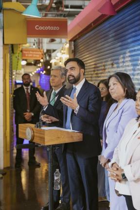 New York City Mayor Zohran Mamdani (at mic) is with Deputy Mayor Julie Su (right) and Manhattan borough president Brad Hoylman-Sigal as the mayor announces at site next to La Marqueta in East Harlem will be the site for the city’s first publicly subsidized grocery store.