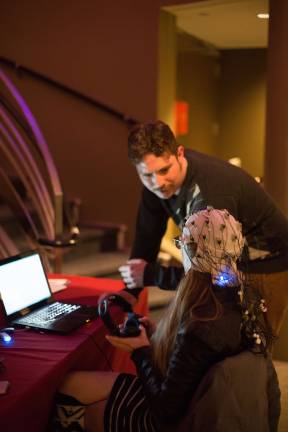 Chris Rose guiding a participant after listening to “9 Beet Stretch.” Photo: Asya Danilova