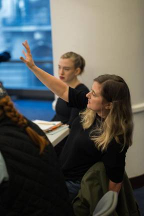 Sarah Norris (hand raised) directs a rehersal of the play “War Words” which just opened a one month run at the Off Broadway A.R.T. Theaters. Photo: Jeremy Verner