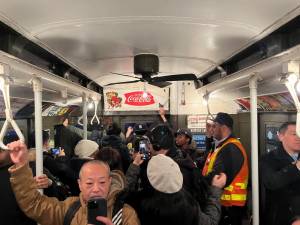 Vintage ads, such as the Coca Cola ad to the rear of the car, adorn the 1930s era subway cars which are providing today’s passengers a chance to travel back in time. The vintage cars run on Sundays only.