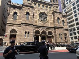 Attendees converse outside the Central Synagogue on Lexington Ave. after the star studded funeral for Clive Davis, who died last week at the age of 94. In a 66-year career, he discovered musical talent from Whitney Houston to Bruce Springsteen.