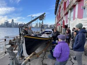 Members of Village Community boathouse say a bittersweet goodbye to the Whitehall Gig they built and rowed. Photo: Lorne Swarthart