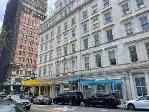Prototypes for two of the six new scaffolding shed designs were installed in lower Manhattan as part of a citywide effort to rebrand street scaffolding.