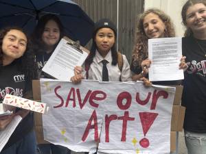 Middle School Students seek signatures to a petition to the Department of Education, urging the city restore the provider of its after school arts program. The DOE is switching from Manhattan Youth to another provider, irking parents.