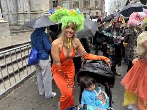 Easter eggs adorned Melissa Vento’s bonnet, while she pushed her son in a stroller through the crowd of revelers at the Easter Parade.
