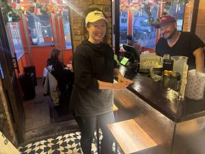 Tiffany Collings and Oscar Hernandez, two of the three co-owners of Wayne &amp; Sons. say they’ll be forced to move the popular taco place if the city forces them to tear down the small enclosed outdoor dining shed in the East Village.