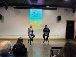 Filmmaker Jamie Kirkpatrick (left) and author Andrew Serra (right) at the book launch party for the novel <i>Hell’s Hundred Acres,</i> held at the community space DCTV, which is in the historic building that once housed FDNY Engine 31 on Lafayette Street.