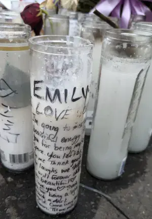 Memorial candles to Emily Ruiz, the fourth victim of the Corlears Hook Park. Car Crash Killer, Daniel Hyden. She was preceded in death by Lucille Pinkney, her son Herman, and Ana Morel.